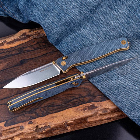 https://www.realsteelknives.com/cdn/shop/files/real-steel-huginn-edc-knife-vg-10-tactical-folding-blade-with-denim-micarta-handle-knife-real-steel-www-realsteelknives-com-2.jpg?v=1699511376&width=460